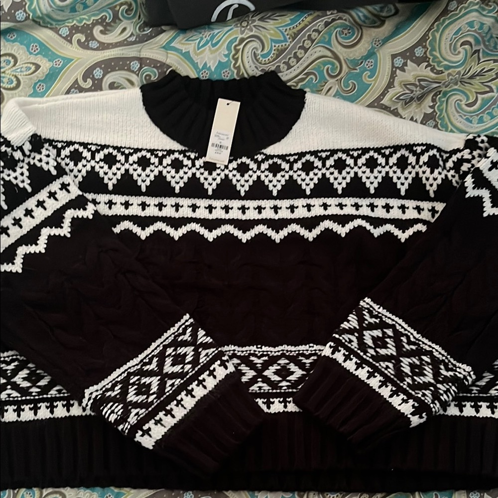 Black and White Patterned Women's Sweater from Francesca’s.